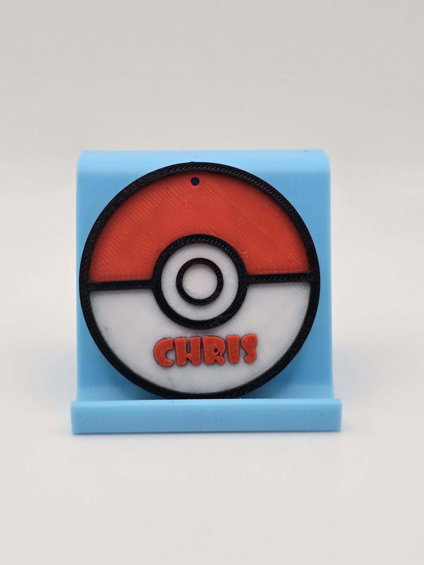 Personalized Pokemon keychain featuring a Pokeball with the name Chris, perfect for Pokemon fans.