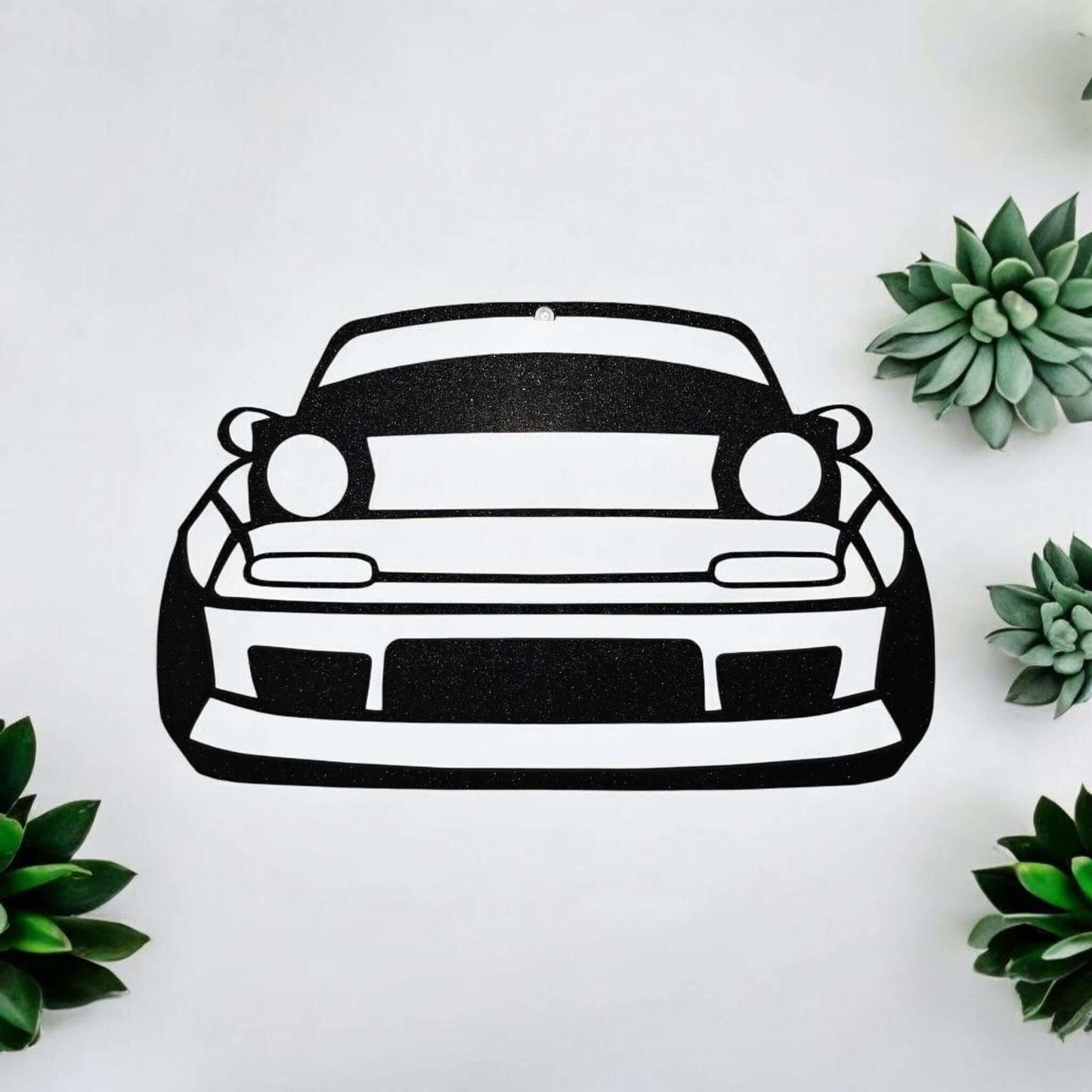 Mazda Miata wall decor featuring a black and white outline of the iconic sports car design.