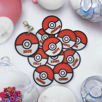 Personalized Pokemon keychain with multiple Pokeballs featuring names like Jack, Charlie, and Lily.