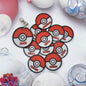 Personalized Pokemon keychain with multiple Pokeballs featuring names like Jack, Charlie, and Lily.