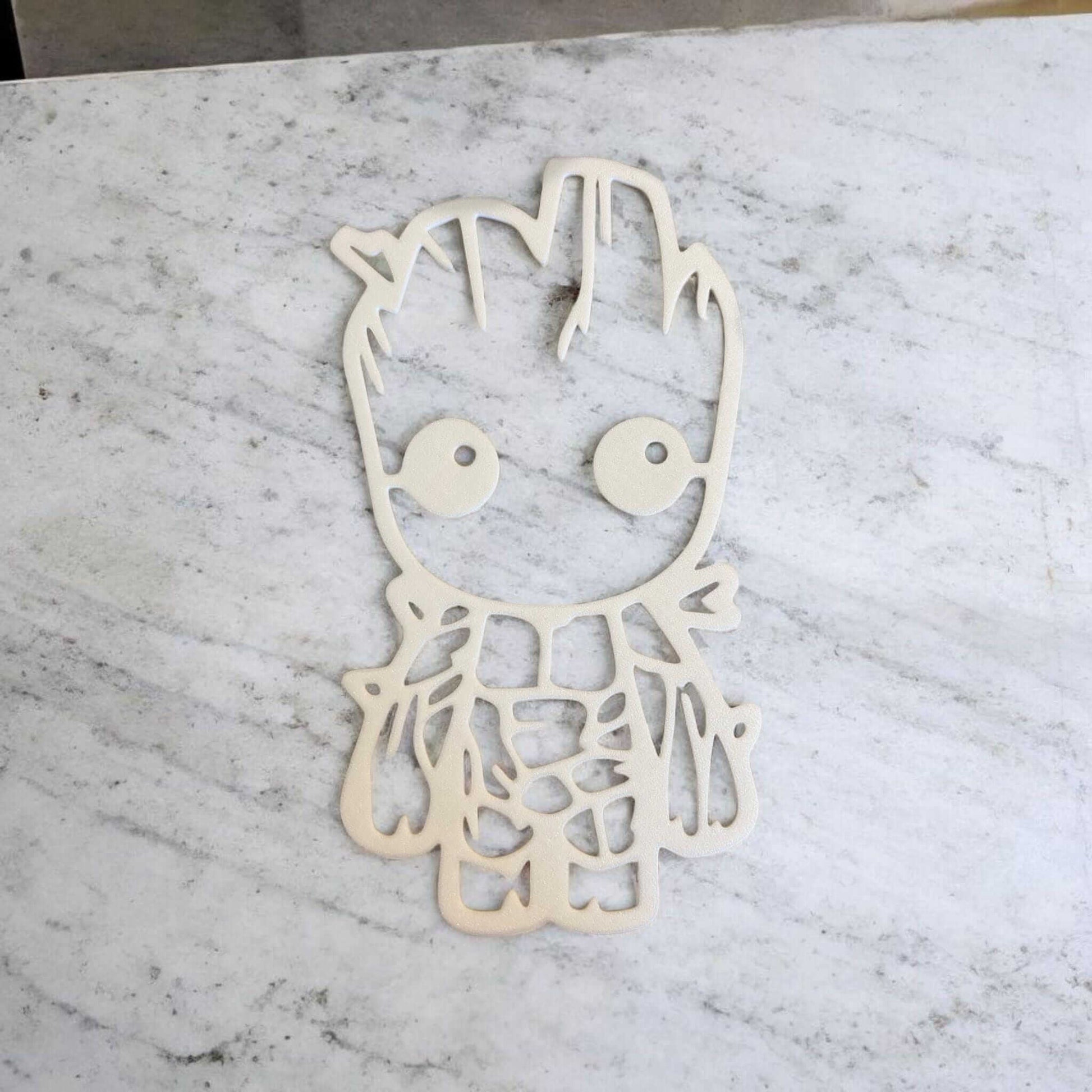 Baby Groot nursery decor on marble background, showcasing detailed 3D printed design.
