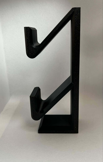 Stylish Xbox Switch controller stand in black, designed for organized gaming setup and easy access.