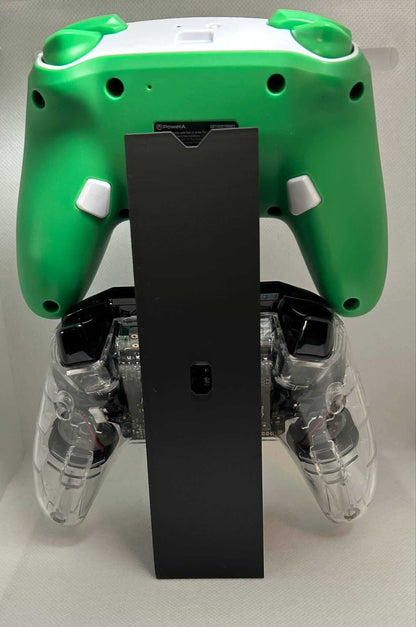 Xbox Switch controller stand displaying a green and clear controller for organized gaming setup.