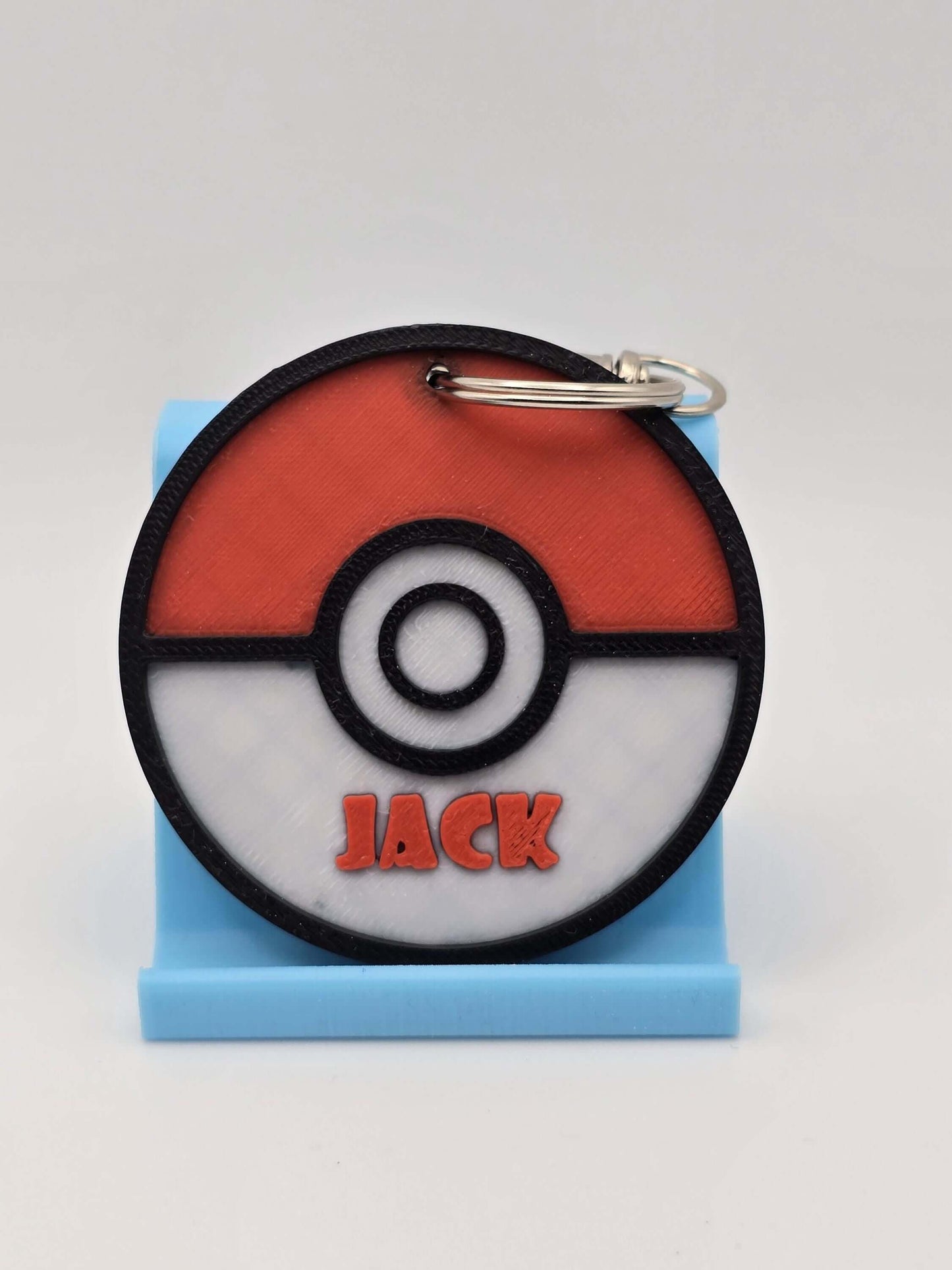 Personalized Pokemon keychain featuring the name JACK on a Pokeball design.