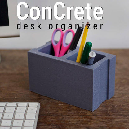 modern industrial desk organizer made to resemble a cinder block with pens and scissors inside