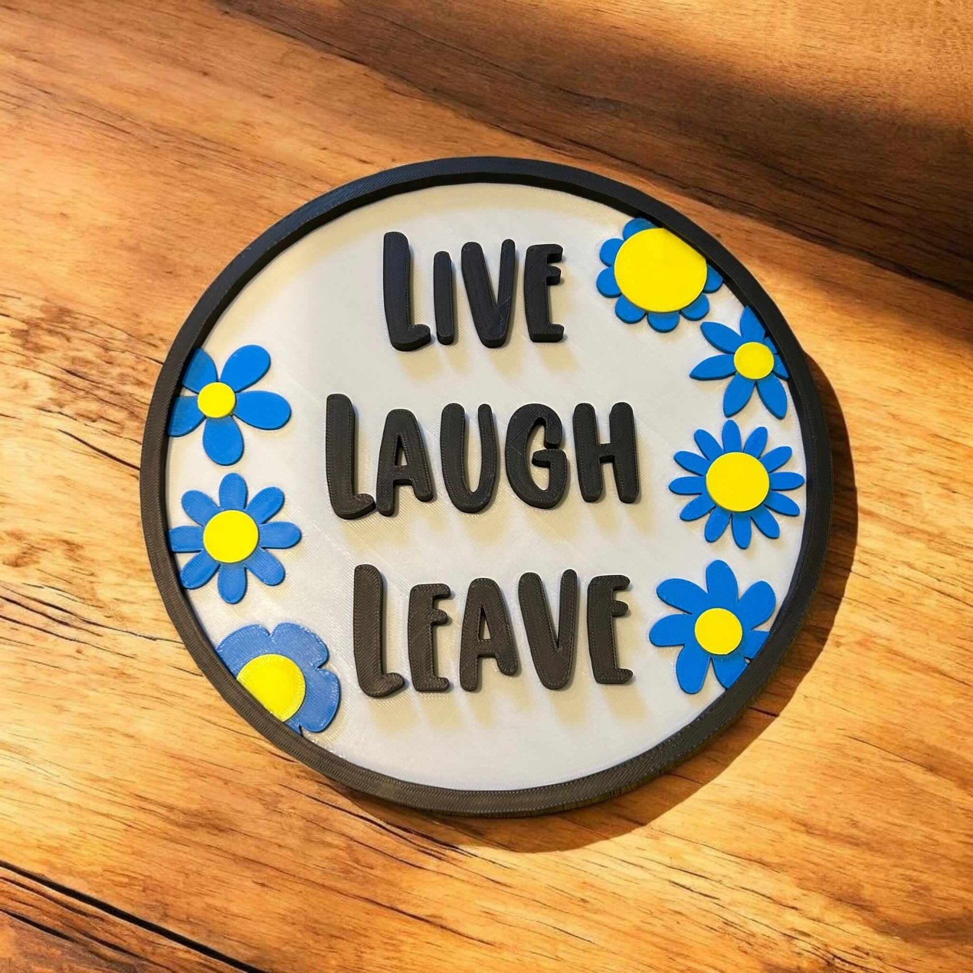 quirky door sign featuring "Live Laugh Leave" with colorful flowers for playful home decor
