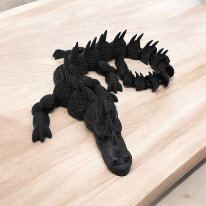 articulated dragon fidget toy on a wooden surface showcasing intricate design and textures.