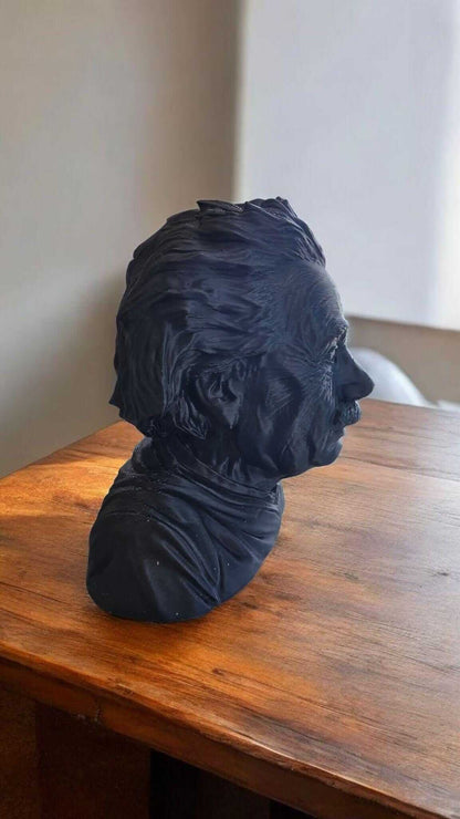3D printed Einstein sculpture displayed on a wooden table, showcasing intricate detailing and modern design.