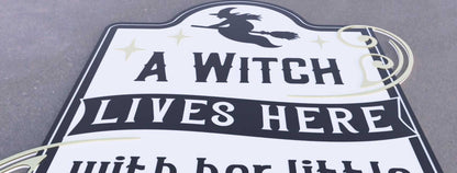 Halloween porch decor sign featuring a witch silhouette and playful text for festive Halloween decoration.